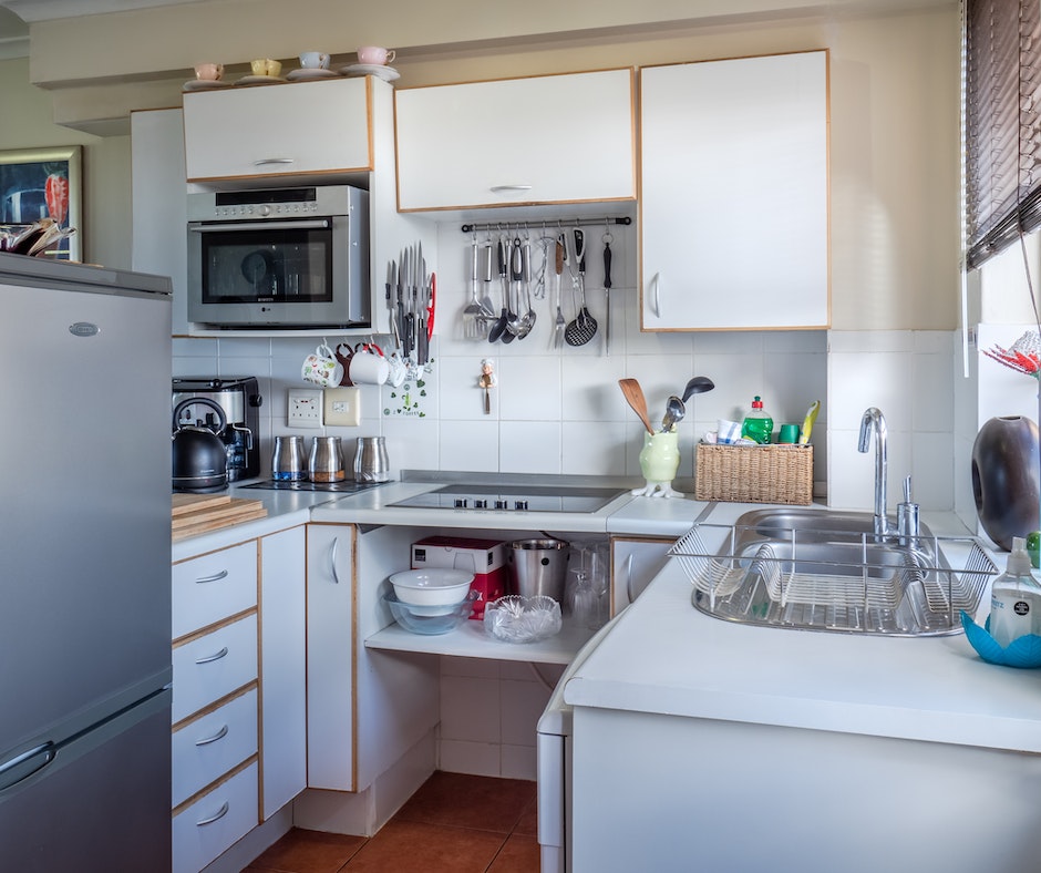 Cozy modern kitchen interior with appliances.